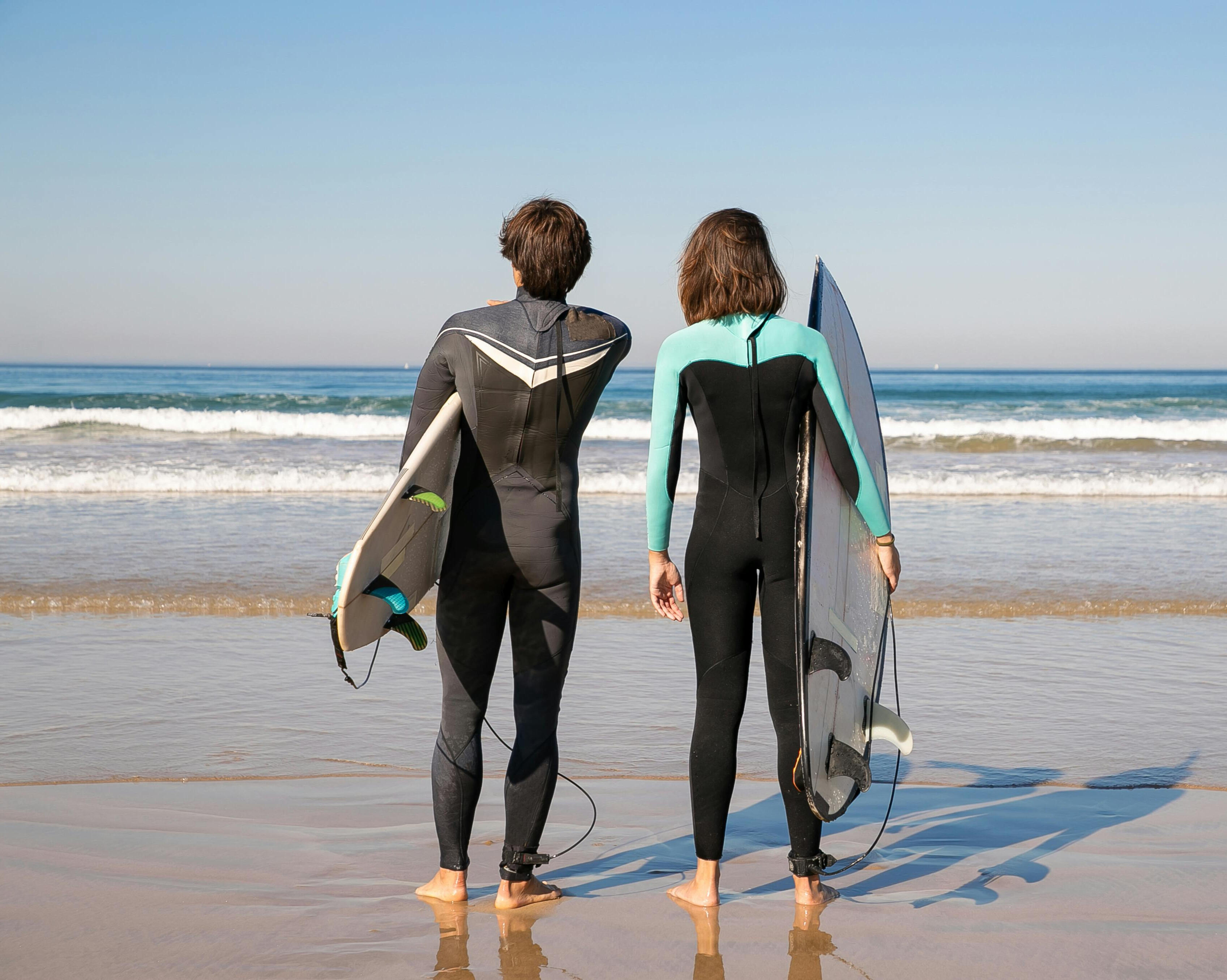 Surfers walking to Baleal Beach with surfboards