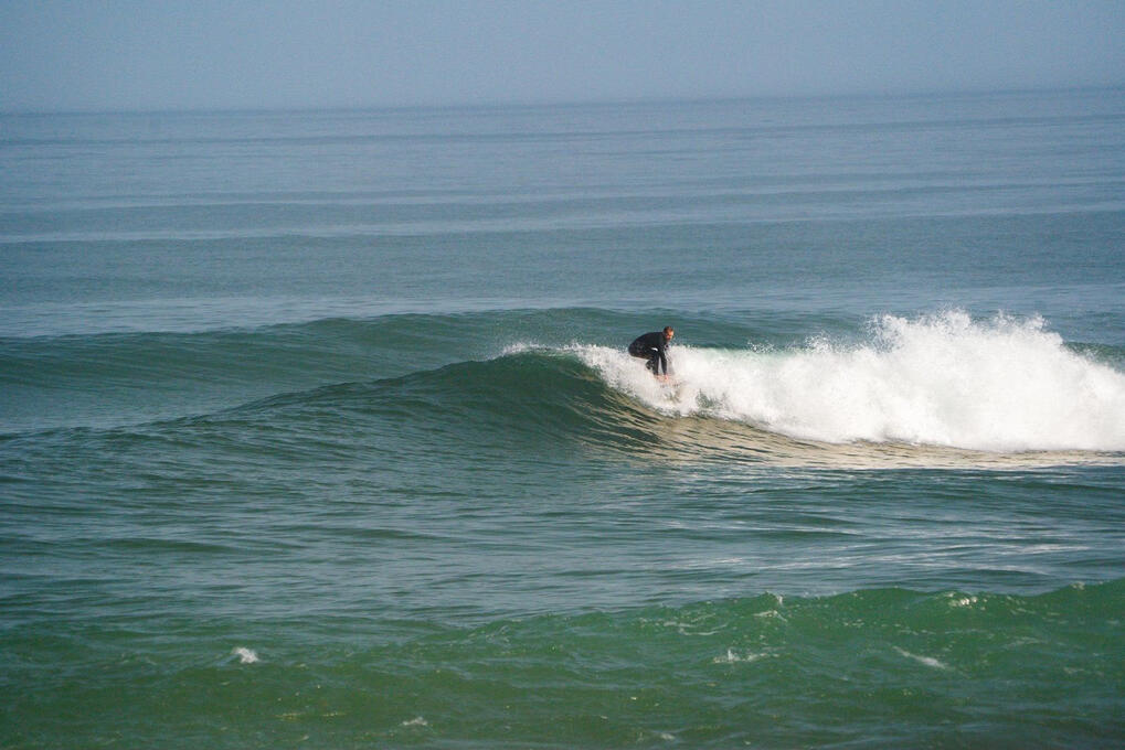 surfer takeoff green wave