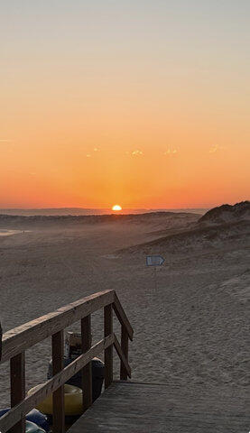 sunset in peniche at the beach dunes